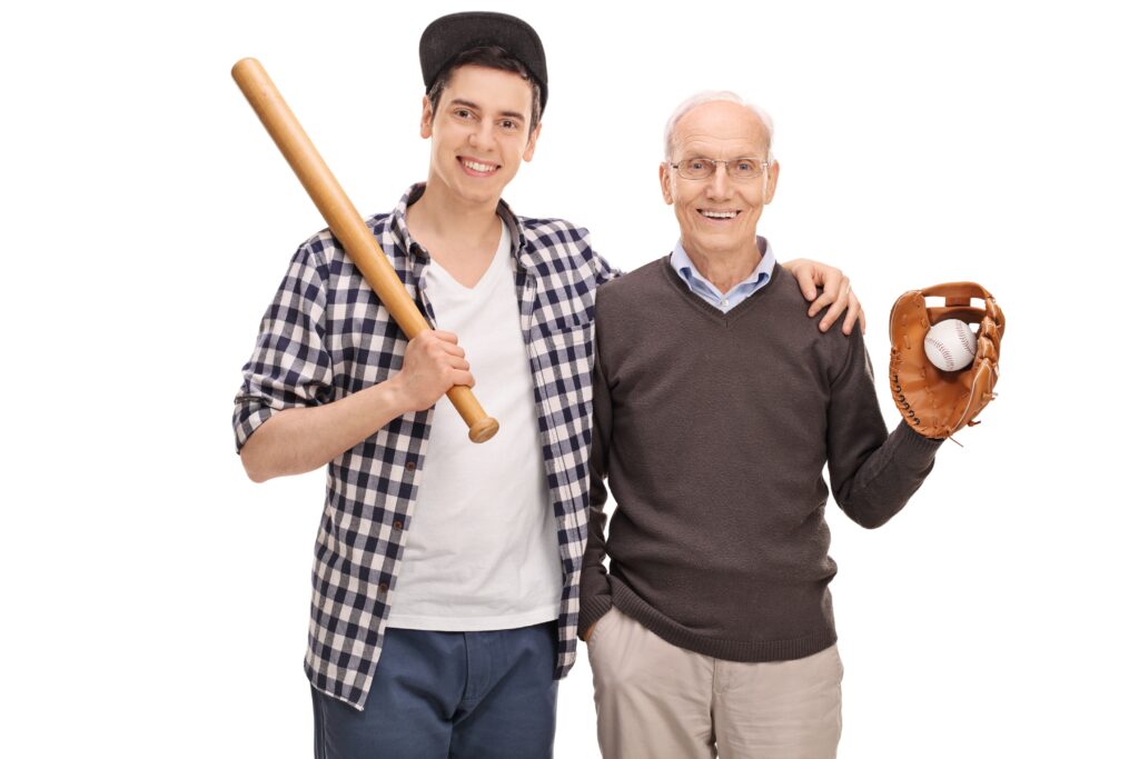Father and son posing with a baseball bat and a ball isolated on white background